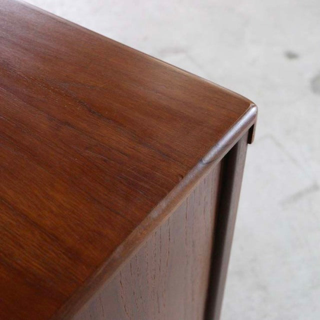 Vintage British mid-century teak sideboard by Nathan with smooth wood grain and rounded edges.