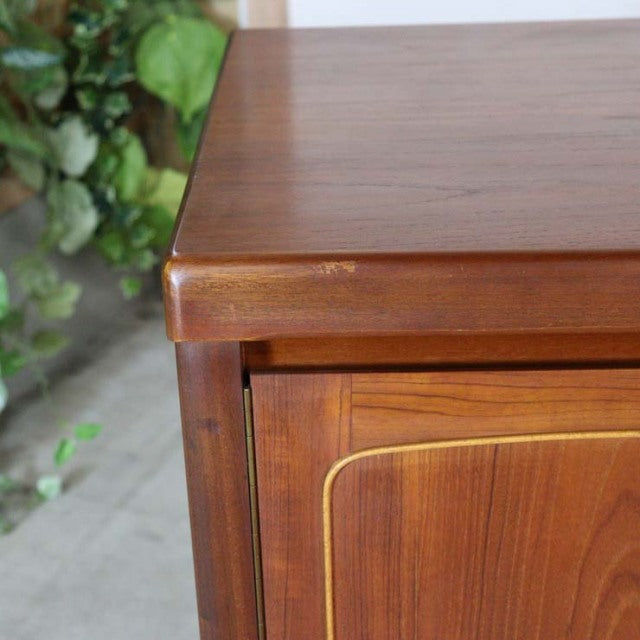 Mid-century British vintage teak sideboard by Nathan with rich wood grain and rounded edges.
