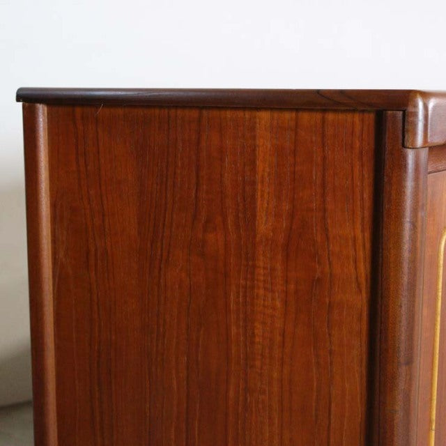 Mid-century British vintage teak sideboard by Nathan with rich wood grain and smooth rounded edges.