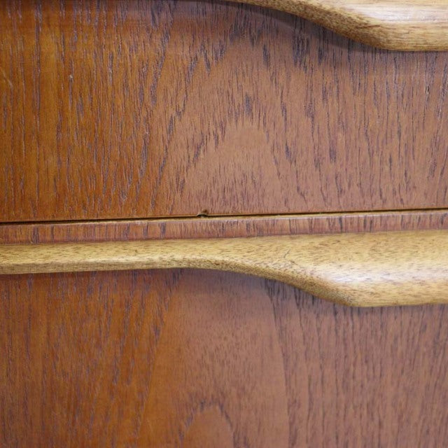 Close-up of vintage teak sideboard from Jentique showcasing smooth wood grain and mid-century British design details.