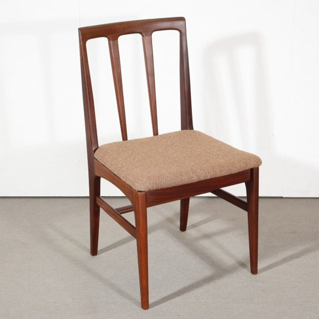Mid-century British vintage teak dining chair with three vertical slats and beige upholstered seat.
