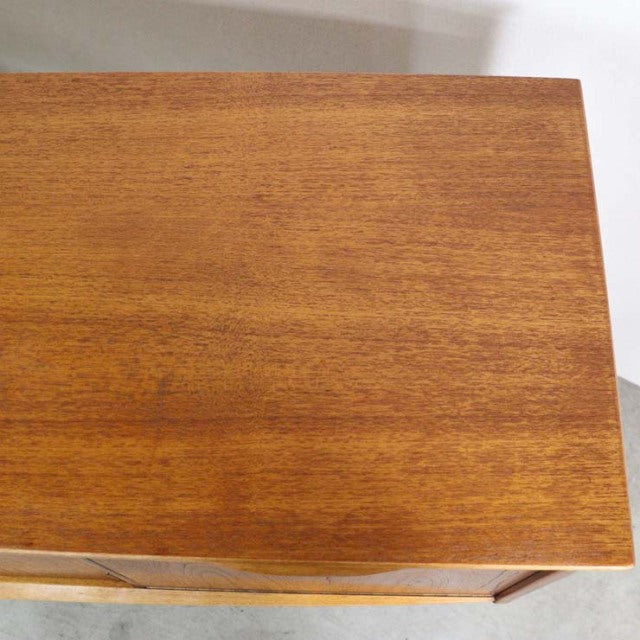 Mid-century teak wood sideboard top with rich British vintage grain, smooth finish, and warm tones.