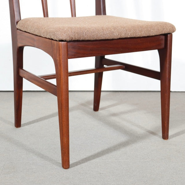 Mid-century vintage teak dining chair by John Herbert for Younger, featuring tapered legs and beige cushioned seat.