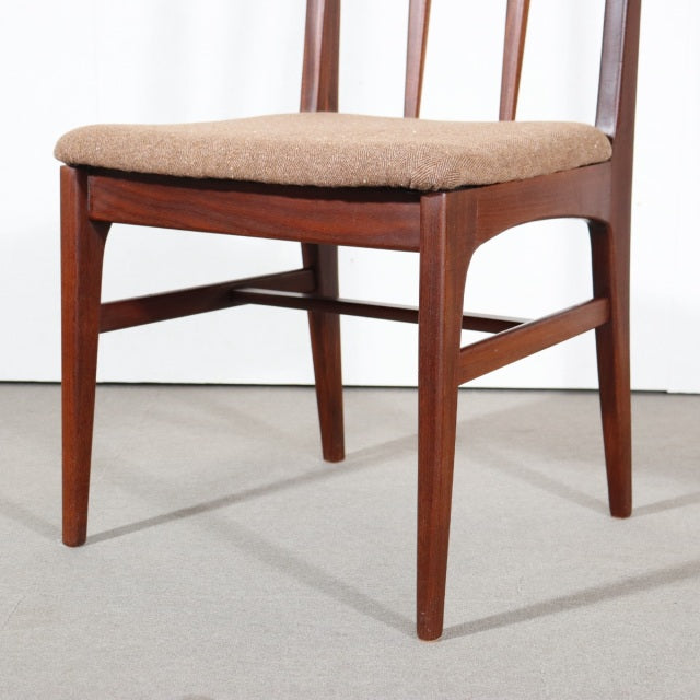 Mid-century British teak dining chair by Younger with tapered legs, vertical slat back, and beige upholstered seat.