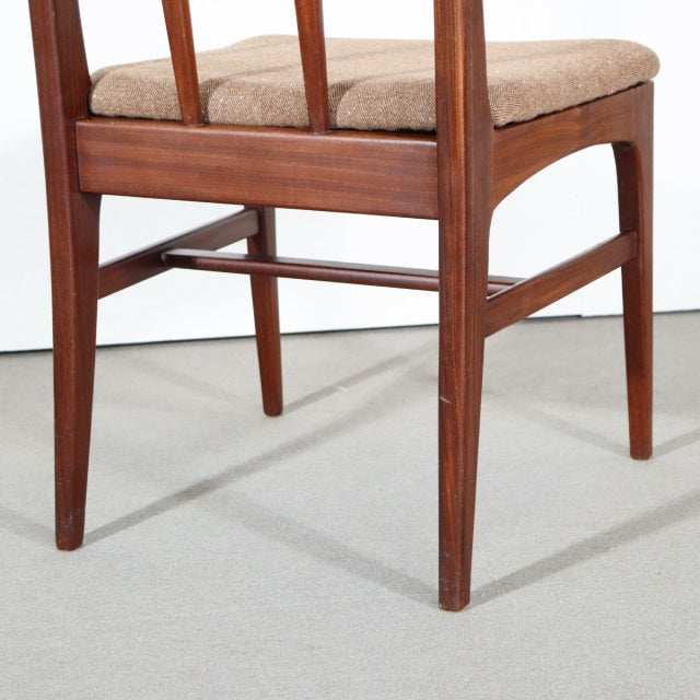 Mid-century British teak dining chair leg and frame with visible wood grain and beige upholstered seat from Younger Fonseca.