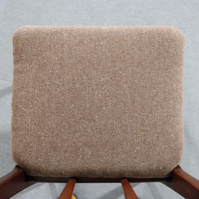 Square beige fabric seat cushion with subtle texture, supported by teak wood frame visible beneath, showcasing vintage.