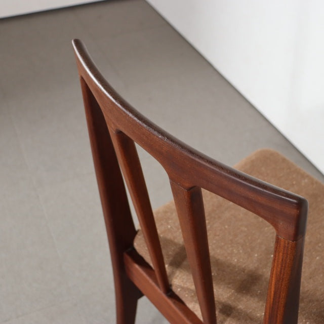 Vintage teak dining chair designed by John Herbert for Younger, British mid-century style with tapered legs and elegant wood .