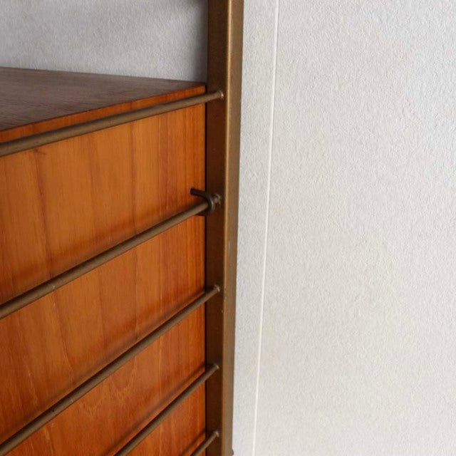 Vintage teak Ladderax unit shelf showing warm wood grain, slender British mid-century vertical supports, and clean Danish.