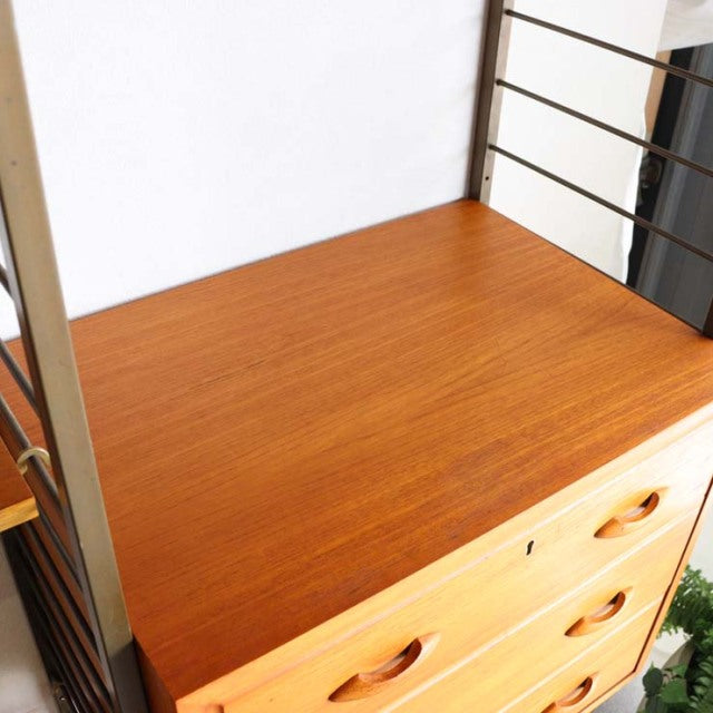 Mid-century British Ladderax unit shelf with teak wood grain surface and metal frame detailing.