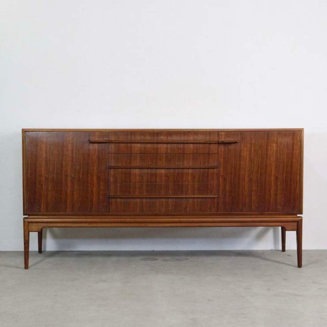 Vintage mid-century British teak sideboard by A.H. McIntosh with sleek wood grain and tapered legs.