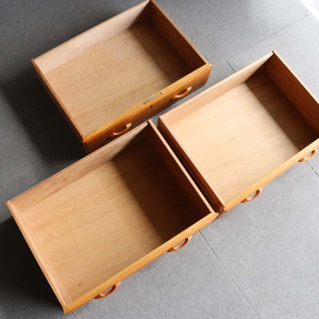 Vintage teak drawers from British Ladderax Ladderax mid-century shelving unit with smooth wood grain and round recessed.