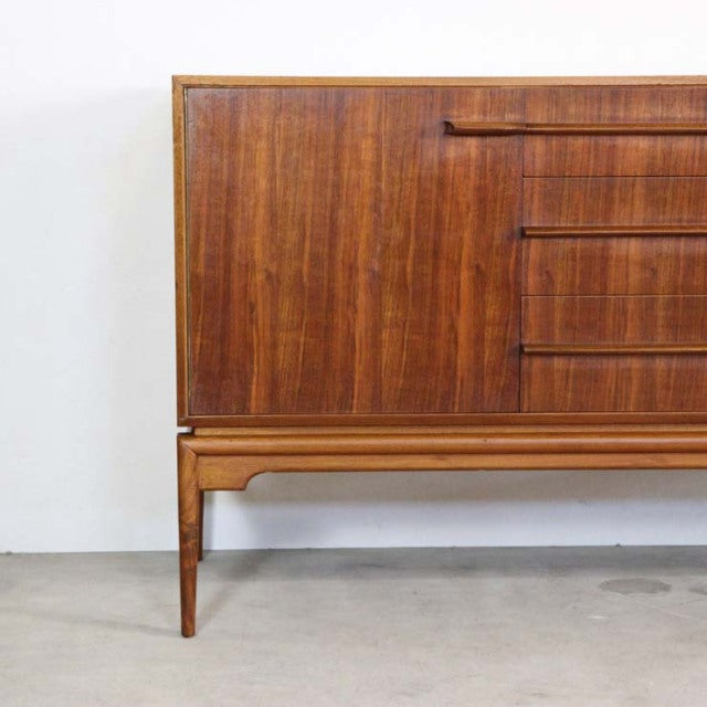 Mid-century British vintage teak sideboard by A.H.McIntosh with rich wood grain, slender legs, and clean lines.