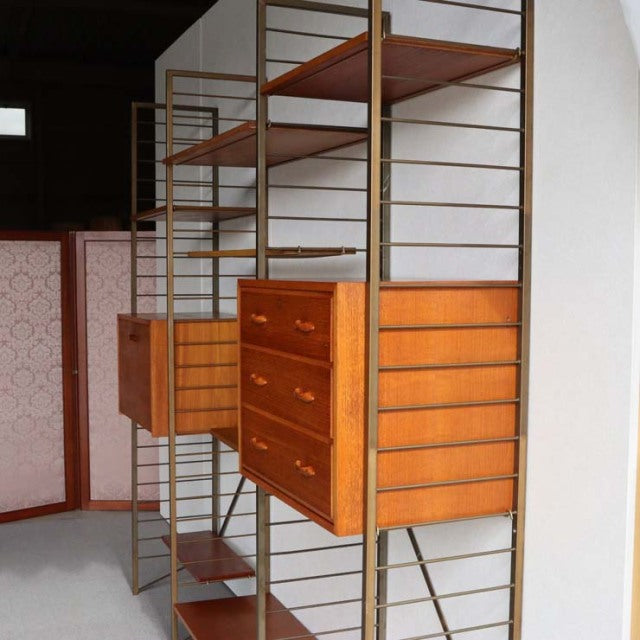 Vintage teak Ladderax unit shelf by Staples, British mid-century design with metal frame, three-drawer chest, and visible.