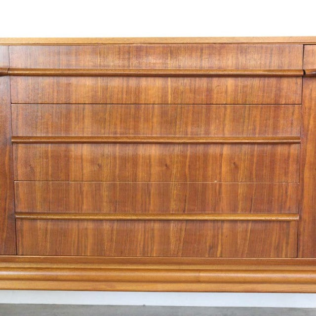 Vintage teak mid-century British sideboard by A.H.McIntosh with distinct wood grain and horizontal wood trim detailing.