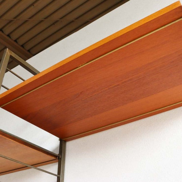 Vintage teak Ladderax shelving unit by Staples, British mid-century design with visible wood grain and brass frame.