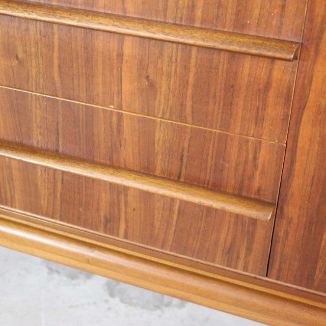 Mid-century British vintage teak sideboard by A.H. McIntosh with rich wood grain and minimalist horizontal handles.