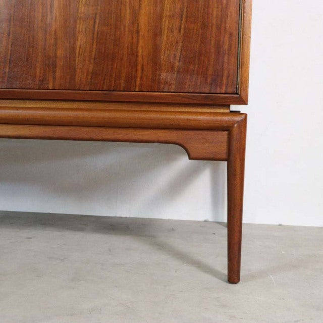 Mid-century vintage teak sideboard leg with tapered design and visible wood grain, British craftsmanship.