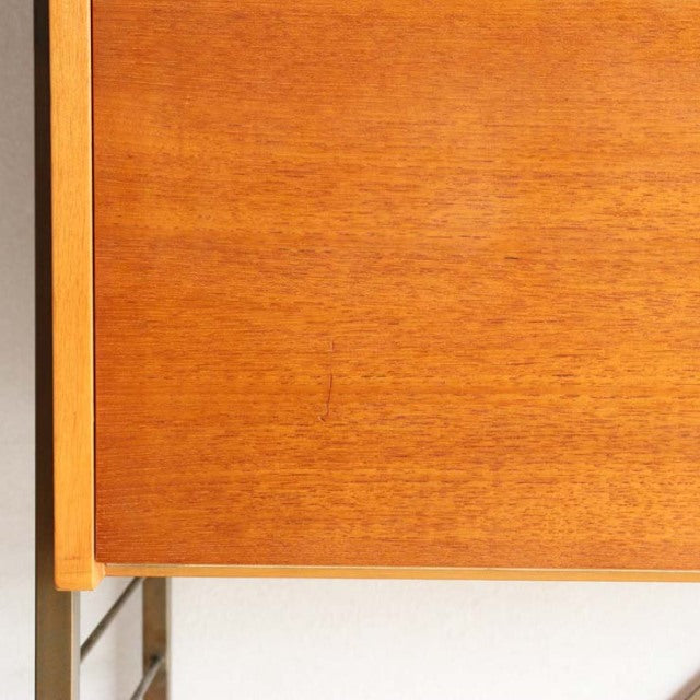 Mid-century vintage teak Ladderax shelving unit with smooth wood grain and slender vertical supports, British-Denmark design.