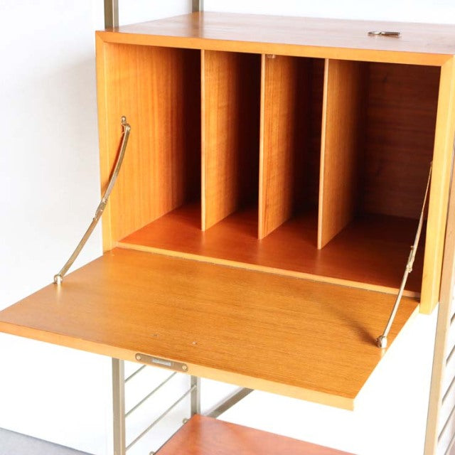 Vintage teak Ladderax unit shelf by Staples, British mid-century design with open drop-front and wood grain panels.