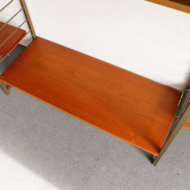 Vintage teak Ladderax mid-century shelving unit with visible wood grain and metal frame, British-Danish design.