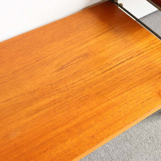 Vintage teak wood shelf from British Ladderax Ladderax unit shelf showing smooth wood grain and warm mid-century Danish.