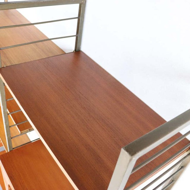 Mid-century Ladderax shelving unit by Staples with teak wood shelves and silver metal frame, vintage British design.