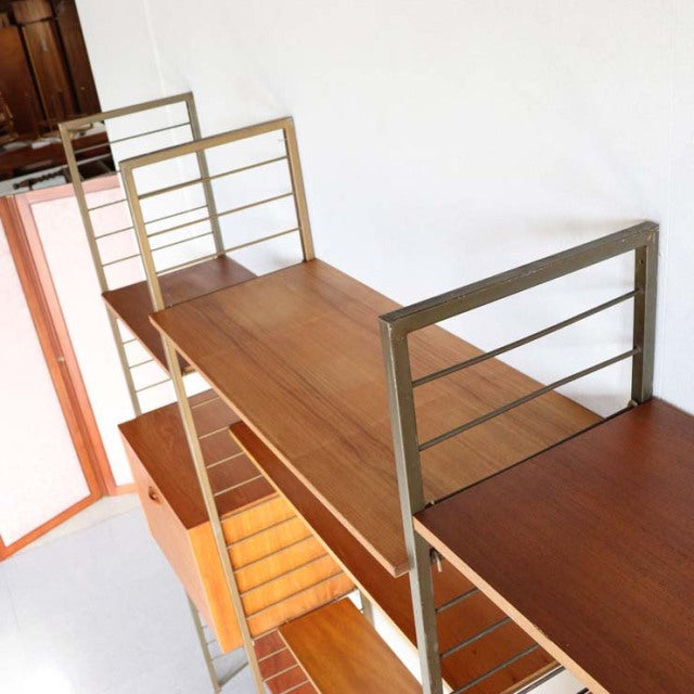 Mid-century British Ladderax shelving unit in teak with distinctive wood grain and metal frame rails, vintage Danish design.