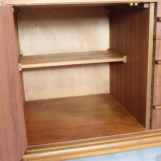 Vintage teak A.H.McIntosh British mid-century sideboard interior with adjustable shelf and wood grain finish.