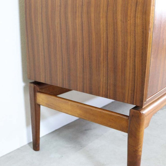 Vintage teak sideboard corner with rich wood grain, British mid-century style, tapered legs, solid craftsmanship.