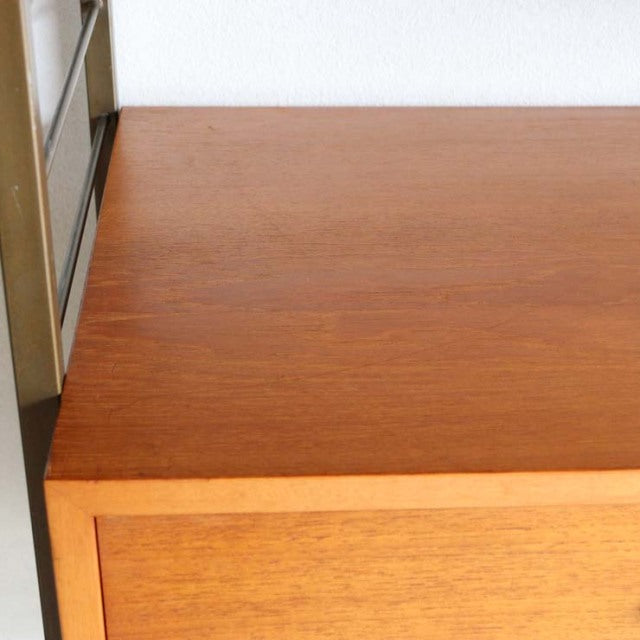 Mid-century vintage teak ladderax unit shelf top corner showing rich wood grain and smooth finish.