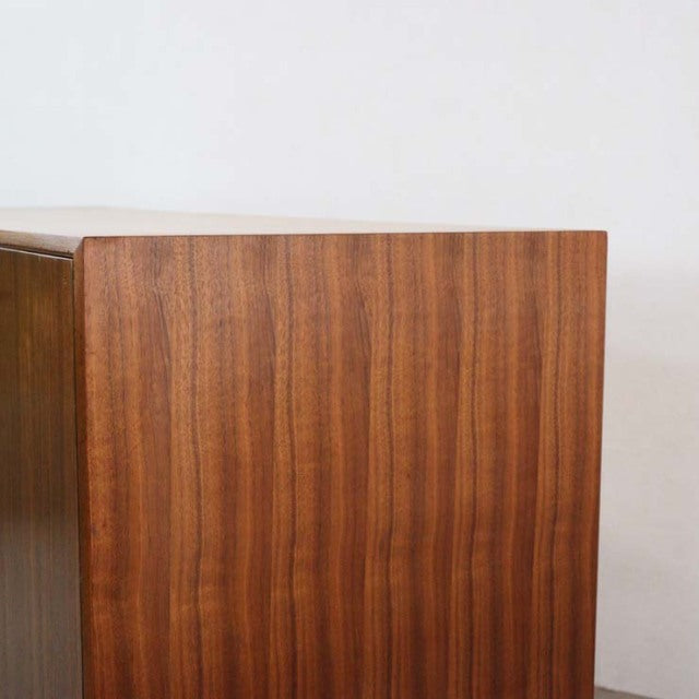 Mid-century vintage British teak sideboard by A.H. McIntosh with smooth wood grain and clean lines.