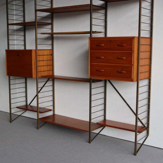 Vintage mid-century Ladderax shelving unit with teak wood drawers and shelves, British design, thin metal frame,.