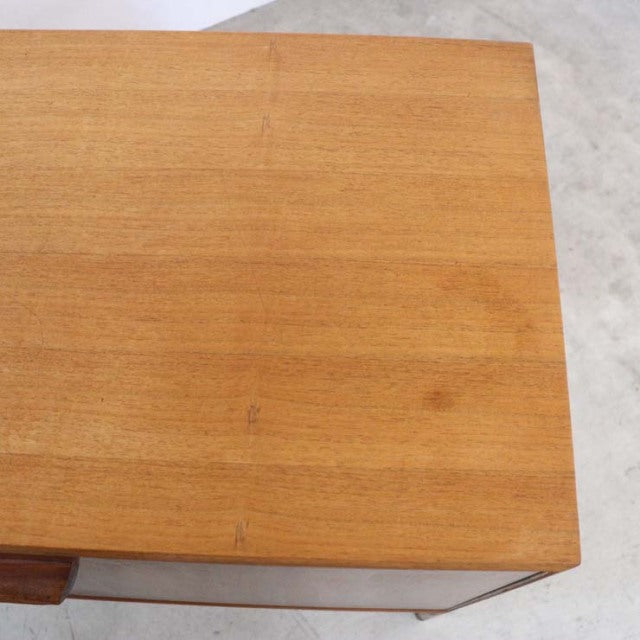 Vintage mid-century teak sideboard top surface showcasing rich wood grain and smooth finish from British-Denmark design.