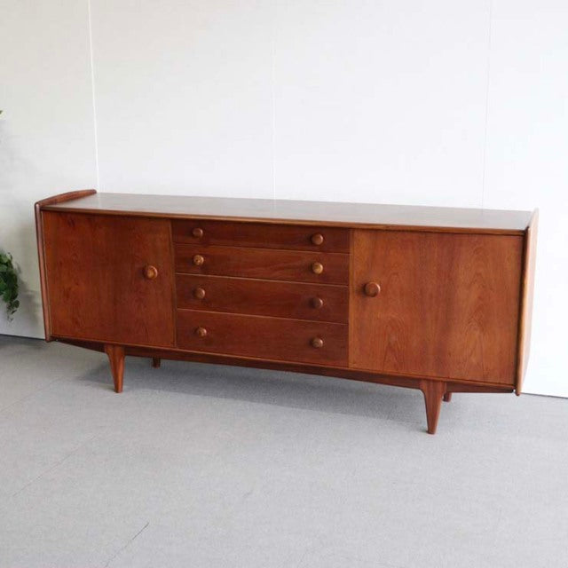 Vintage mid-century teak sideboard by Younger with British-Denmark design, featuring rounded corners, four central drawers.