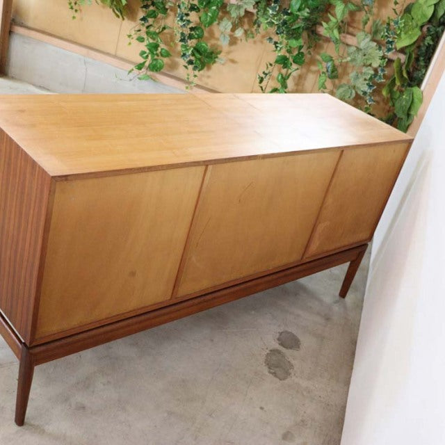 Vintage teak sideboard by A.H.McIntosh, mid-century British design with clean lines and tapered legs, showcasing warm wood.