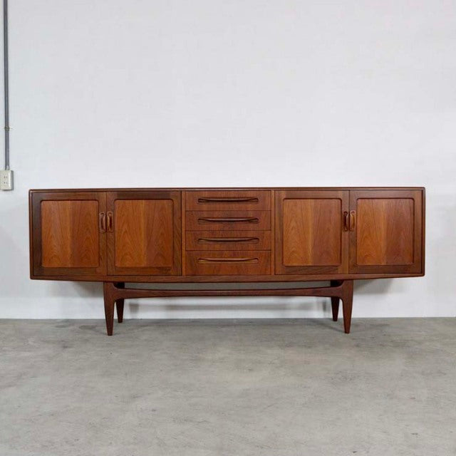 Mid-century British vintage G-Plan Fresco sideboard in teak with rich wood grain, central drawers, and four paneled doors on .