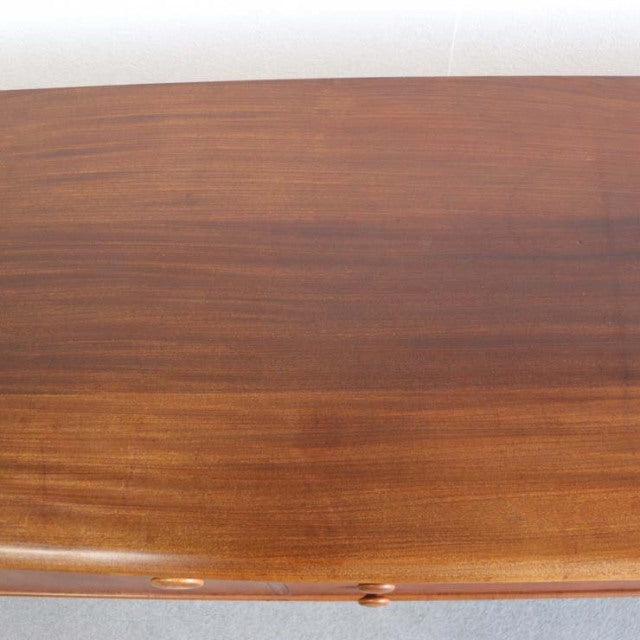 Vintage teak sideboard top showcasing smooth wood grain and warm mid-century Danish craftsmanship.