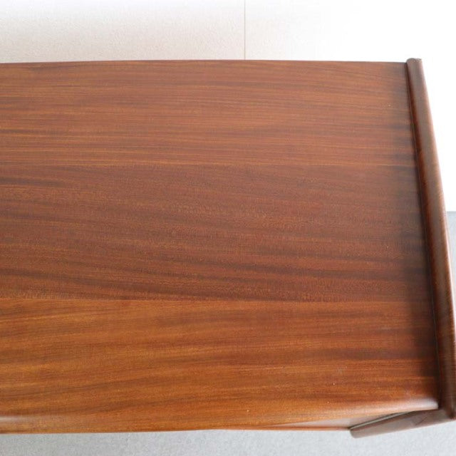 Vintage teak sideboard top with rich wood grain, British mid-century design from Denmark, smooth polished finish.