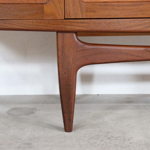 Mid-century British vintage teak sideboard leg with smooth grain and tapered design, Danish style craftsmanship.