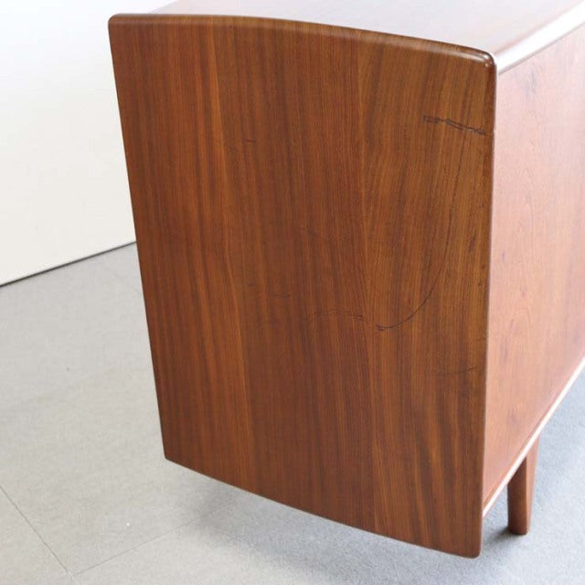 Mid-century vintage teak sideboard by Younger with smooth wood grain and rounded edges, British design.