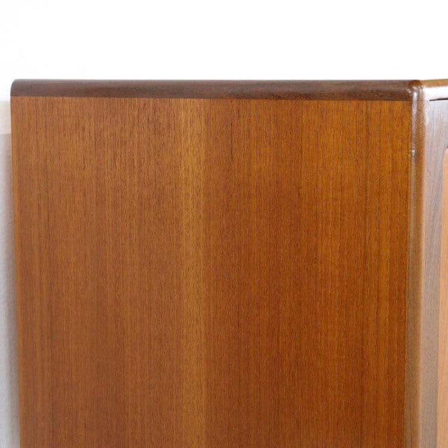 Mid-century British vintage G-Plan Fresco sideboard in warm teak with smooth wood grain and rounded edges.