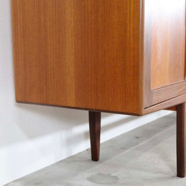 Vintage teak G-Plan Fresco sideboard leg detail with rich wood grain and mid-century British design.