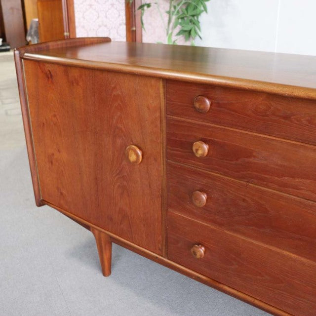 Mid-century British vintage teak sideboard by YOUNGER with rich wood grain, round wooden knobs, and tapered legs in Danish.