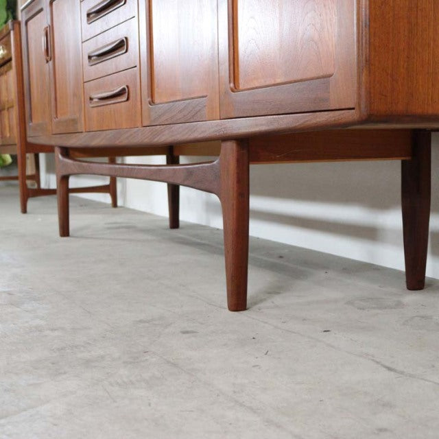 Mid-century British vintage teak sideboard with smooth wood grain, tapered legs, and clean lines by G-Plan.