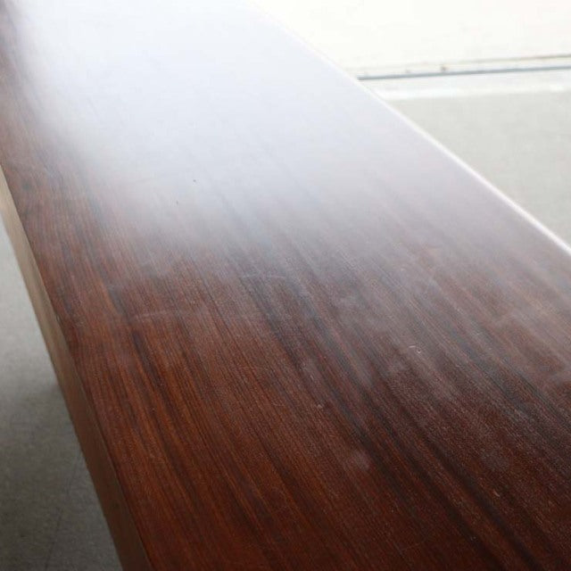 Vintage teak British mid-century sideboard top showcasing rich wood grain and smooth finish.
