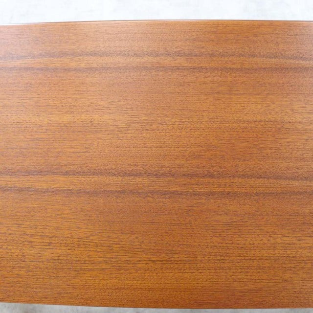 Close-up of smooth teak wood grain tabletop on vintage British mid-century G-Plan Fresco sideboard.