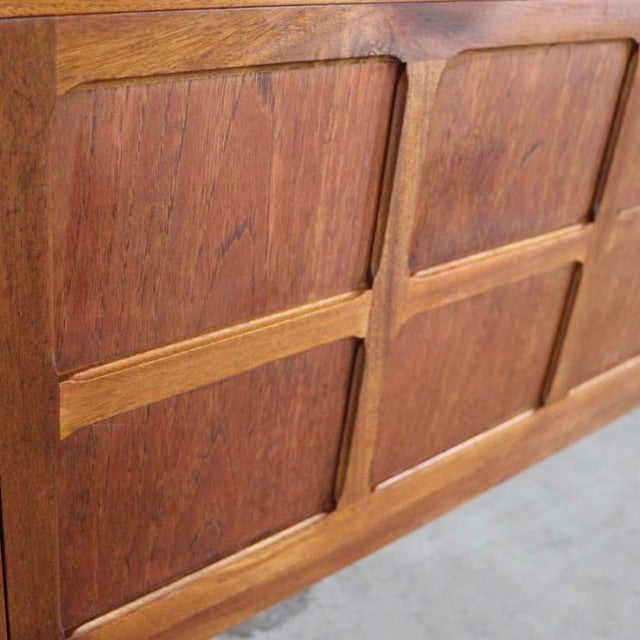 Close-up of vintage British mid-century Nathan teak sideboard door panels showcasing rich wood grain and smooth finish.