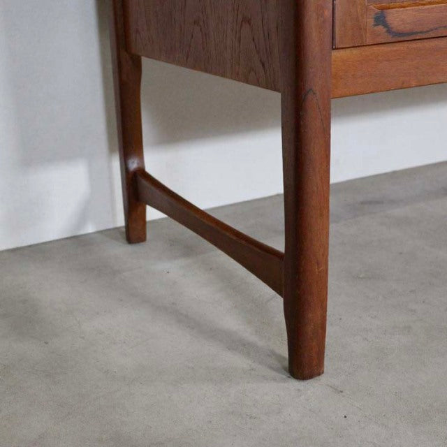 Mid-century British vintage teak sideboard leg with visible wood grain and tapered design, Denmark style craftsmanship.