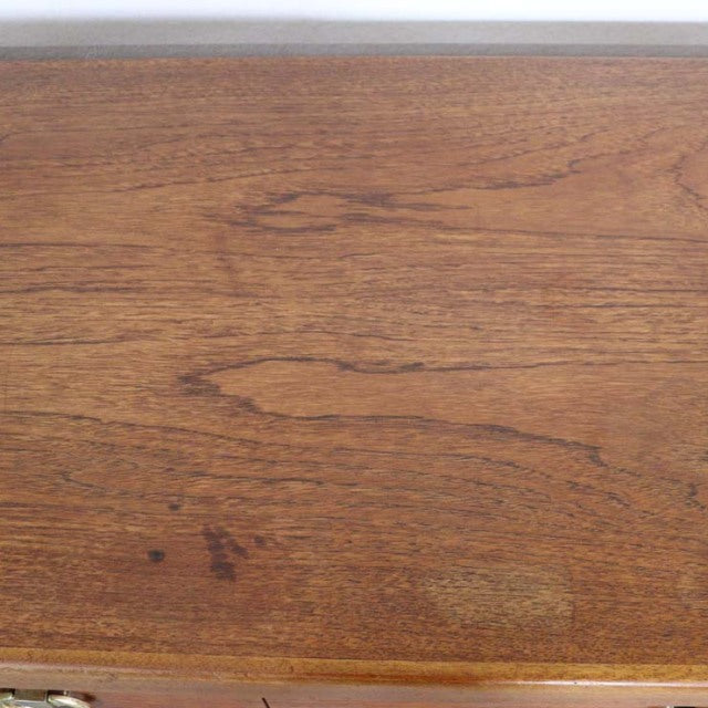 Vintage teak wood surface of British mid-century Nathan sideboard with rich grain patterns.