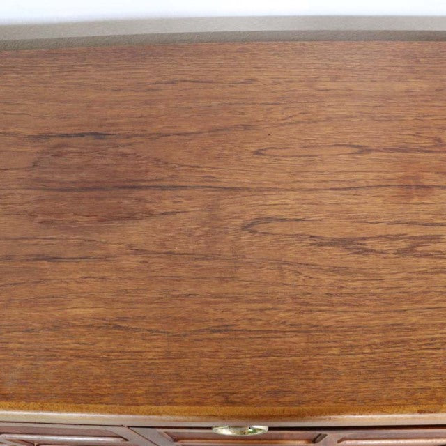 Vintage teak British mid-century sideboard top with rich wood grain and warm tones.